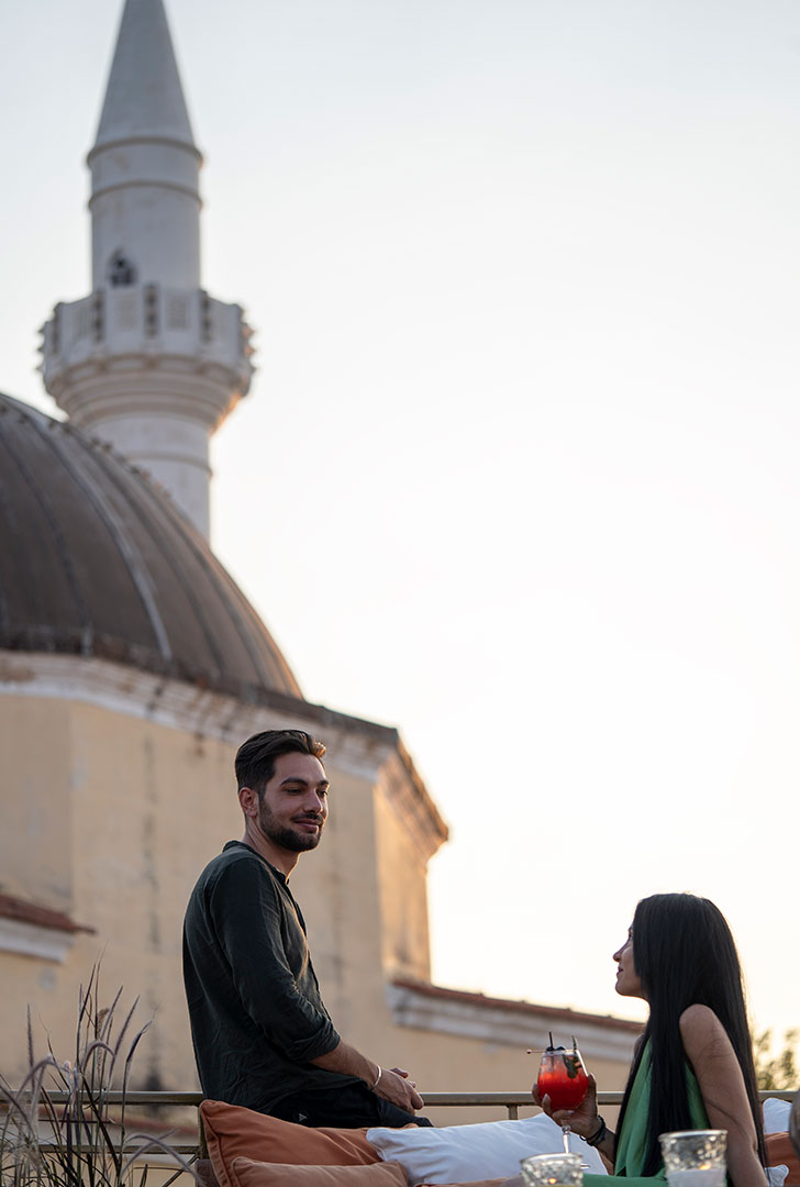 Decan Concept Boutique Estate Hotel Rhodes visitors enjoying a drink at the rooftop terrace