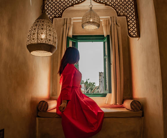 Decan Concept Boutique Estate Hotel Rhodes Family Room Old Town View visitor looking out from the window