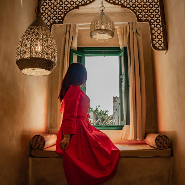 Decan Concept Boutique Estate Hotel Rhodes Family Room Old Town View visitor looking out from the window