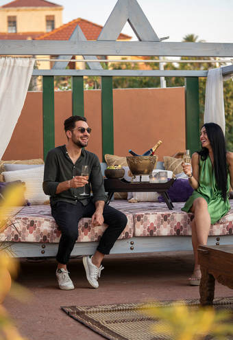 Decan Concept Boutique Estate Hotel Rhodes visitors sitting at the rooftop couch
