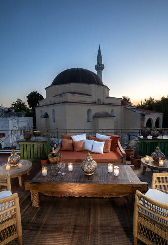 Decan Concept Boutique Estate Hotel Rhodes rooftop with a mosque in the background