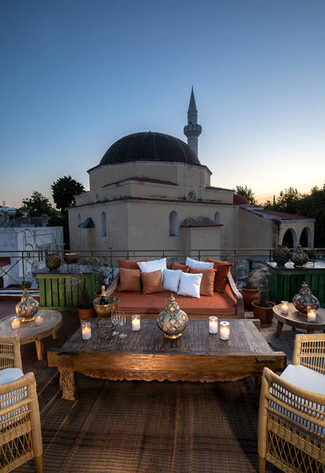 Decan Concept Boutique Estate Hotel Rhodes rooftop with a mosque in the background